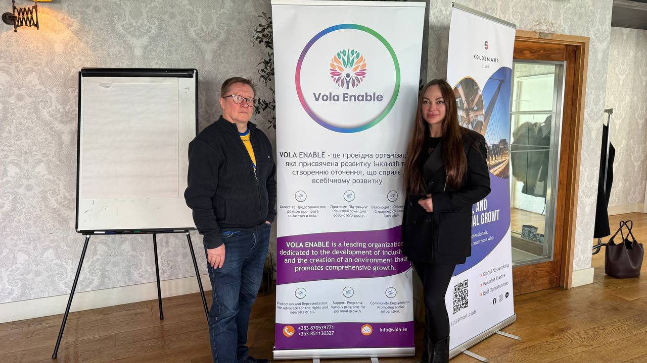 Vola Enable co-founders Viktor Kozyrev and Mila Kulinich beside the organisation’s banner